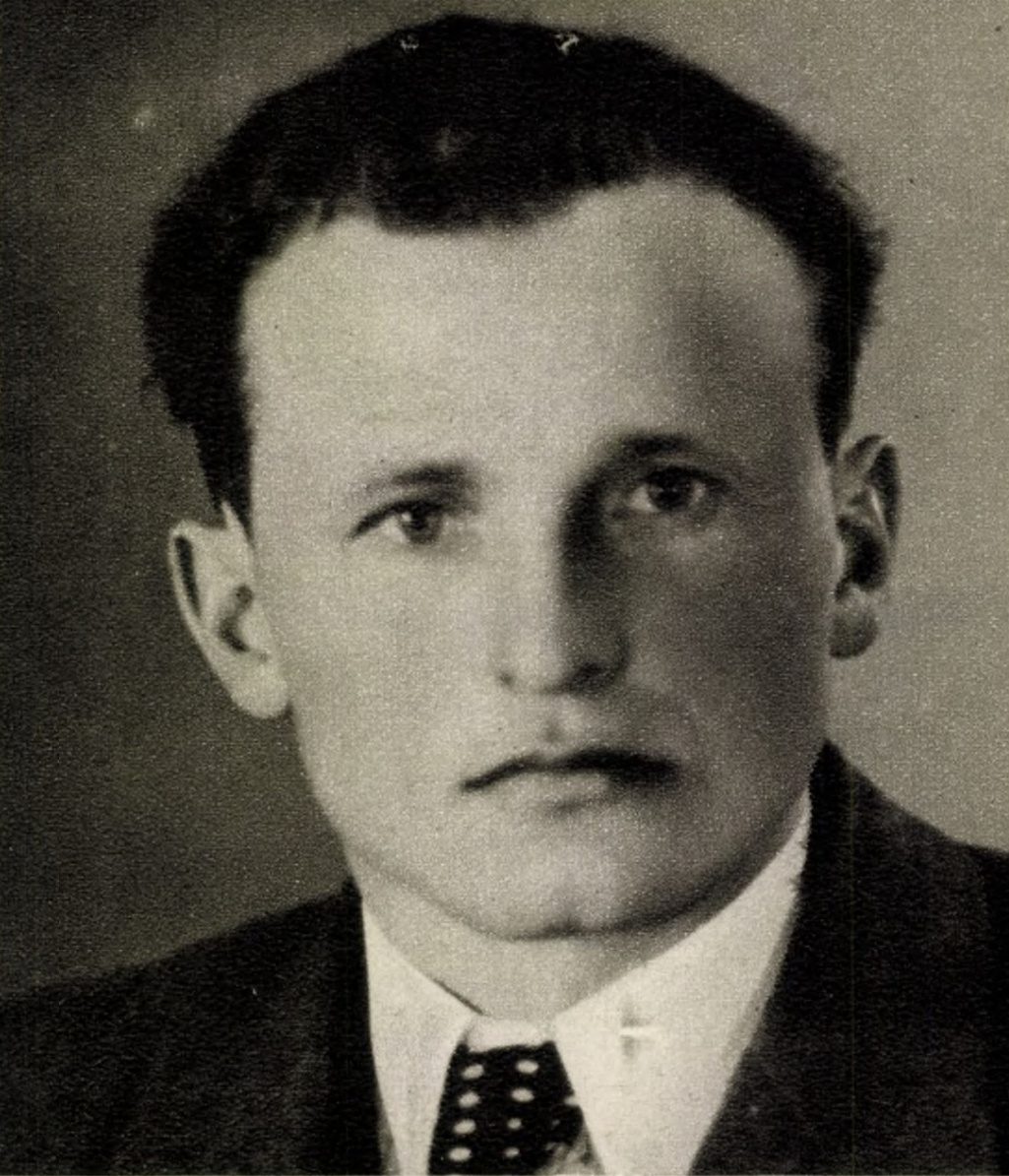 Josef Roupec, black and white head and shoulders portrait of a man with dark swept back hair, in a suit and spotted tie