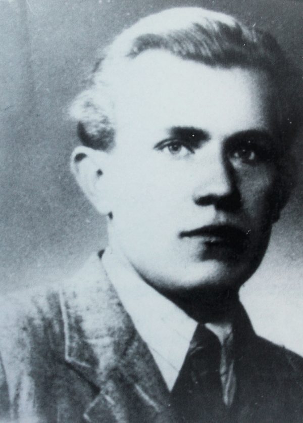 Ladislav Maly, black and white studio portrait of a young fair-haired man in a jacket and tie