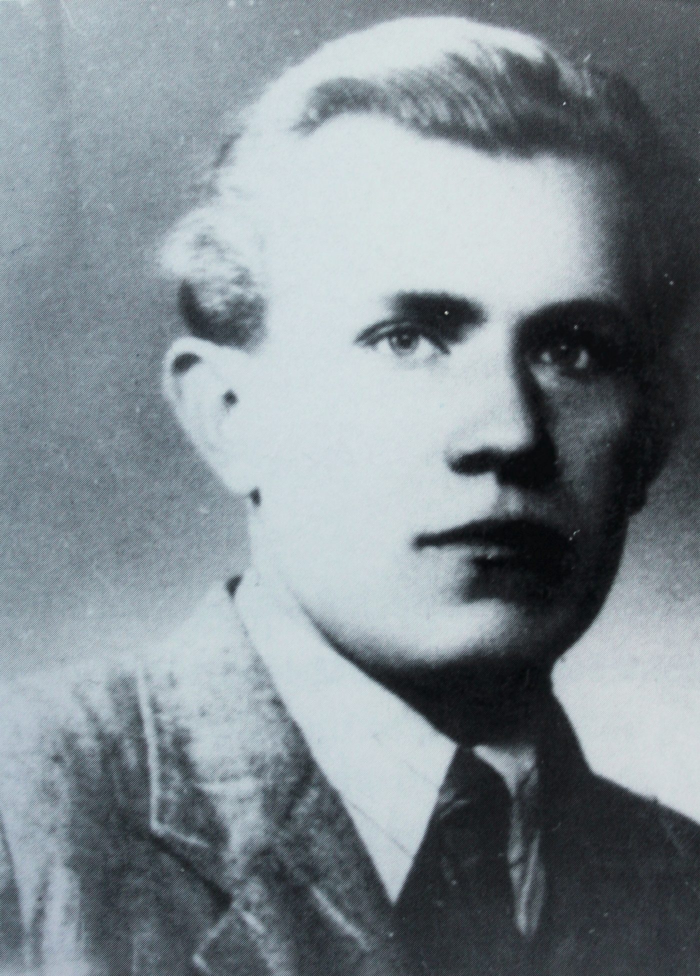 Ladislav Maly, black and white studio portrait of a young fair-haired man in a jacket and tie
