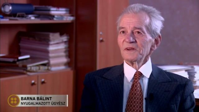 Balint Barna interviewed in an office, the programme's caption naming him as a retired prosecutor