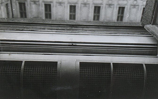 A view out and down from the bathroom window on 10 March 1948 onto the stone cornice that runs the length of the facade, with the windows of the opposite wing above it