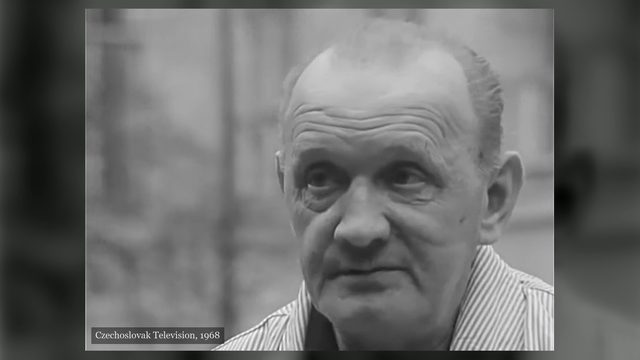 Josef Pánek filmed close up out of doors in a striped open necked shirt, the background thrown out of focus behind him, Czechoslovak Television, 1968