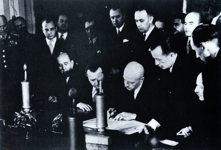 The signing of the Czechoslovak and Polish treaty in Warsaw on 10 March 1947; seated from the left Jan Masaryk, Klement Gottwald and Józef Cyrankiewicz