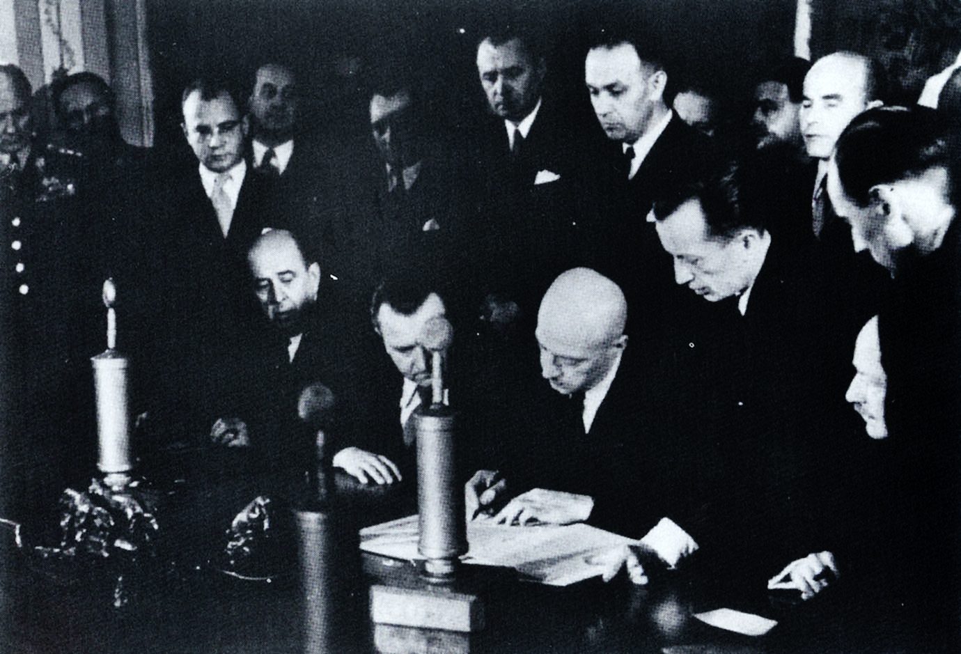 The signing of the Czechoslovak and Polish treaty in Warsaw on 10 March 1947; seated from the left Jan Masaryk, Klement Gottwald and Józef Cyrankiewicz
