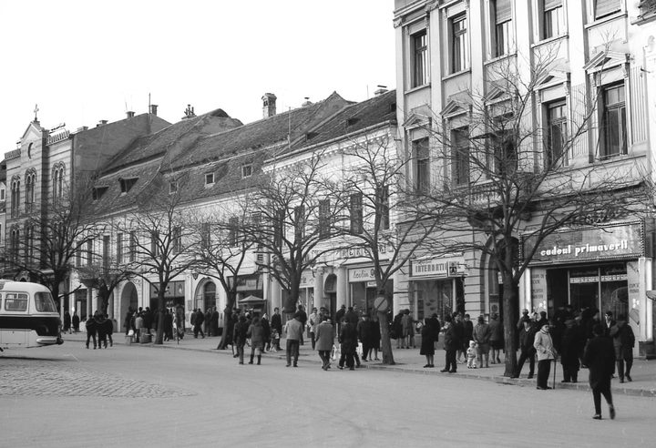 The northeast side of Piața Sfatului, the council square in Brașov, in 1968, with period shopfronts and pedestrians