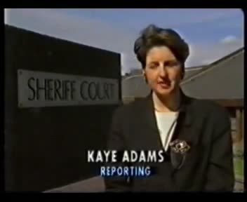 A television frame of the reporter Kaye Adams standing beside a sign reading Sheriff Court, with the caption Kaye Adams reporting across the lower part of the picture