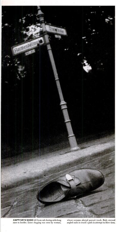 A shoe lying on a cobbled West Berlin street under a street sign, photographed for LIFE in July 1952, with the printed caption about the captive's shoe