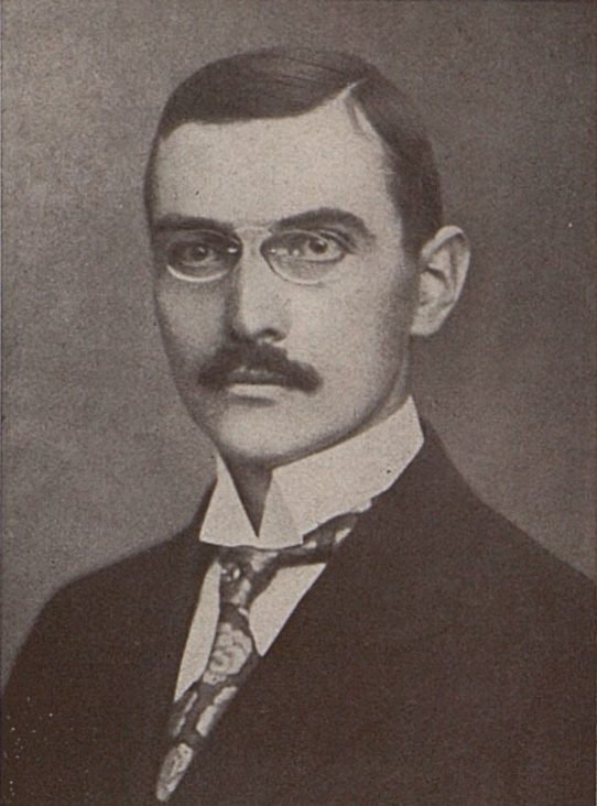 František Hájek in a studio portrait, in glasses, a moustache and a dark jacket